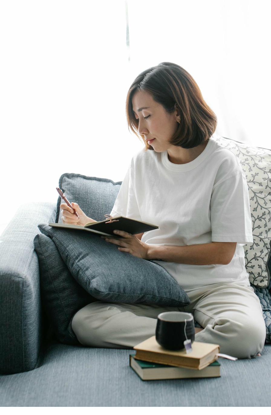 Person journaling through anxiety in Chicago therapy